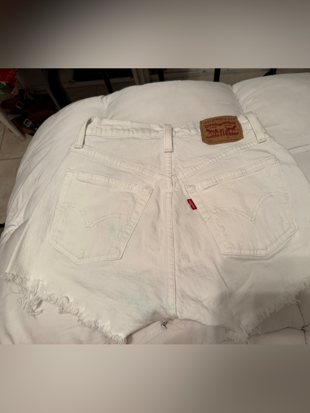 Levi's White Denim Cutoff Shorts with Frayed Hem